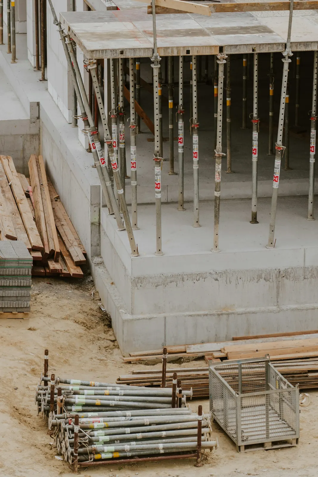 Concrete foundation forms and lumber on a building site