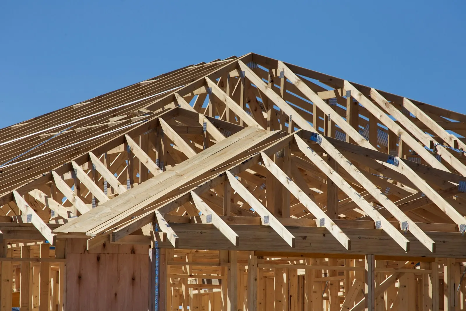Wood roof trusses assembled on a new house frame